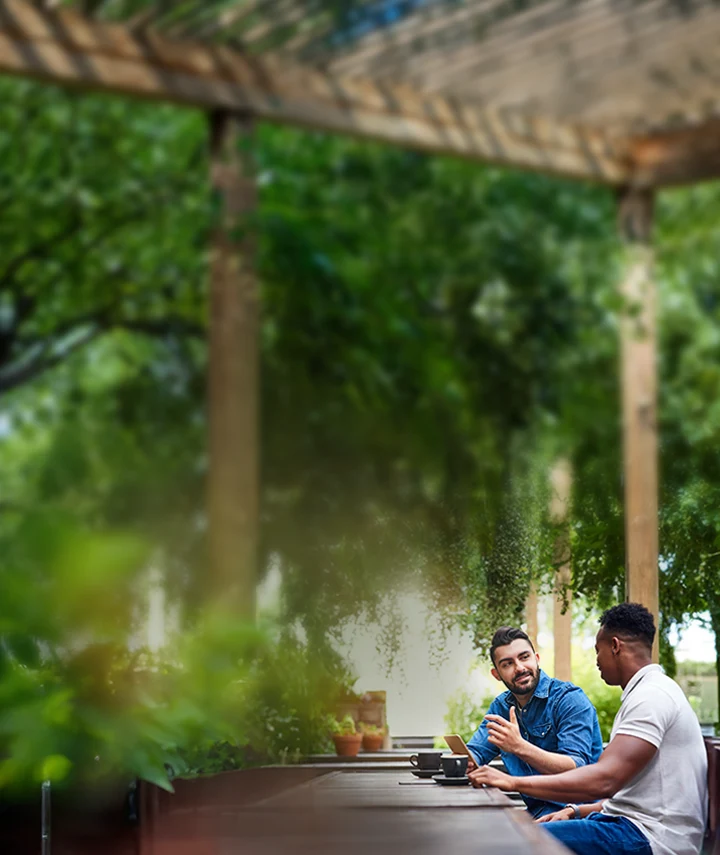 Two friends chatting over coffee